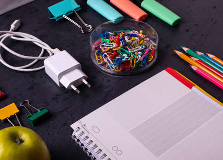 different stationary items on dark concrete surfaceの写真素材