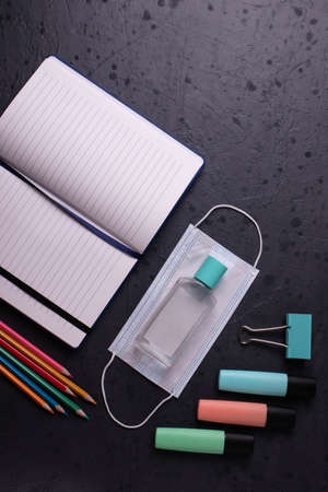 different stationary items on dark concrete surface