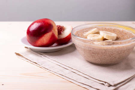 natural vegan oat granola cooked porridge and bananaの写真素材