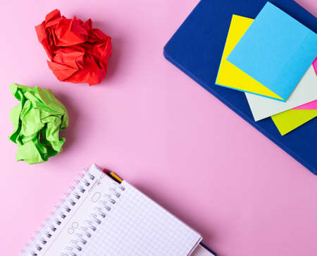 different stationary items and notebooks on the yellow background. minimalism. flat layの写真素材