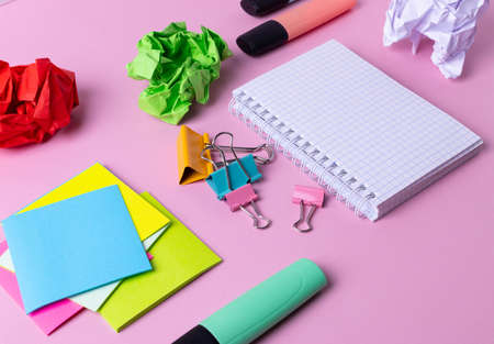 different stationary items and notebooks on mono color background. minimalism. flat lay