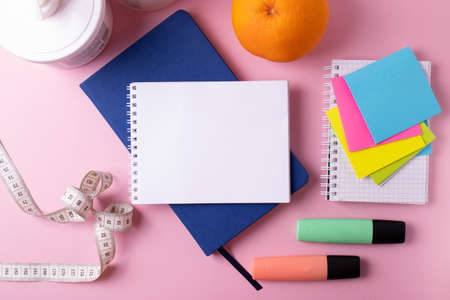 different stationary items and notebooks on mono color background. minimalism. flat layの写真素材