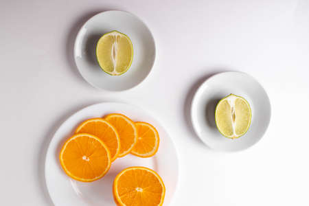 citruses cut in slices on light backgroundの写真素材