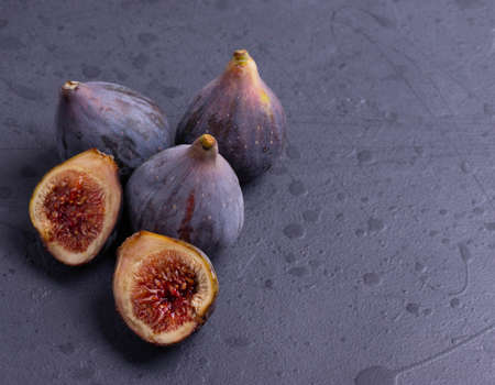 fresh ripe sweet figs on rustic backgroundの写真素材