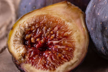 fresh ripe sweet figs on rustic backgroundの写真素材