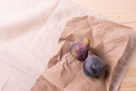 fresh ripe sweet figs on rustic backgroundの写真素材