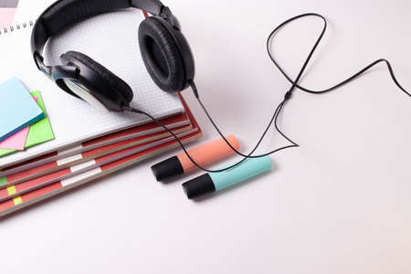 different stationary supplies items on white office or studying desk