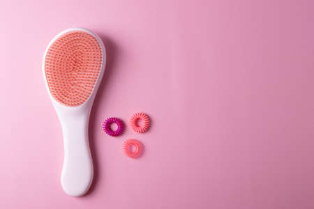 two hairbrushes  on the pink background. space for text. minimalism styleの写真素材