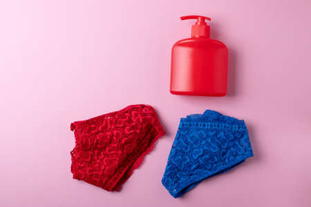 beautiful lingerie and a container bottle with liquid body washの写真素材
