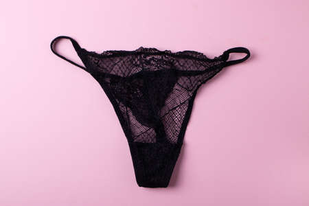 women lace silk panties on pink background