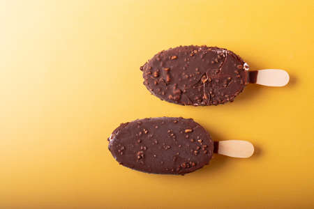 vanilla and chocolate ice cream on yellow
