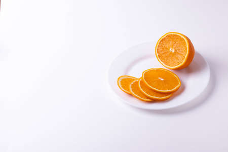 citruses cut in slices on light background