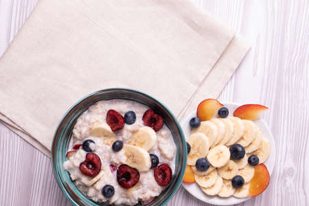 morning oat meal in a glass bowl with peaches