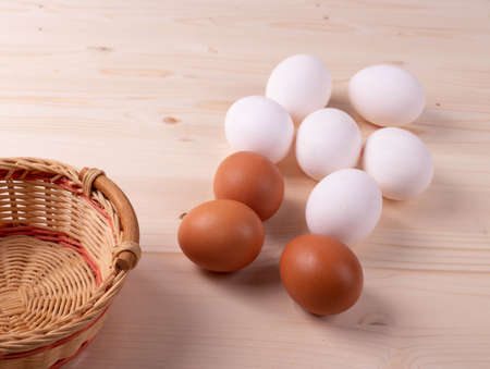 a group of raw chicken eggs on rustic style surface