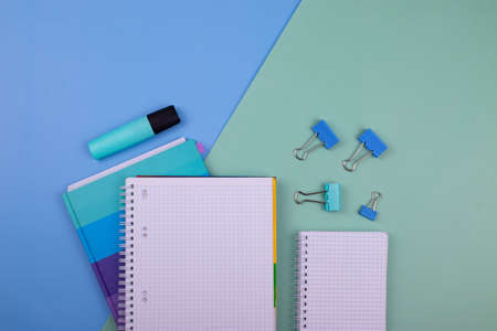 notebooks on mint color background: schooling or office conceptの写真素材