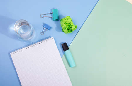 notebooks on mint color background: schooling or office concept