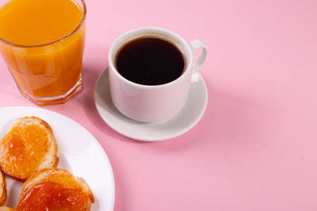 orange jam toasts and drink as breakfast conceptの写真素材