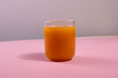 a glass of orange juiceの写真素材