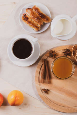 sweet tasty honey pastry treats and espresso as coffee break conceptの写真素材