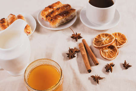 sweet tasty honey pastry treats and espresso as coffee break conceptの写真素材