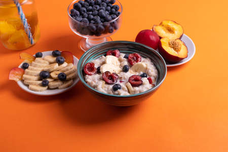 fruit and oat meal porridge for breakfastの写真素材