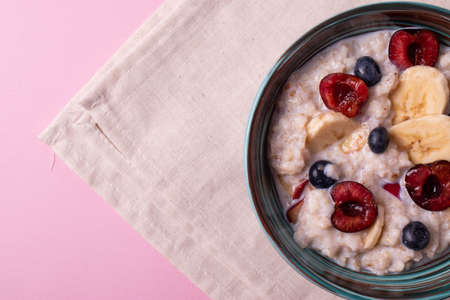 fruit and oat meal porridge for breakfastの写真素材