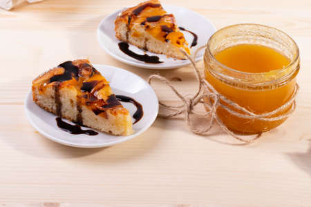 delicious banana and honey, apricot pie. selective focus. close up shot. wooden surface
