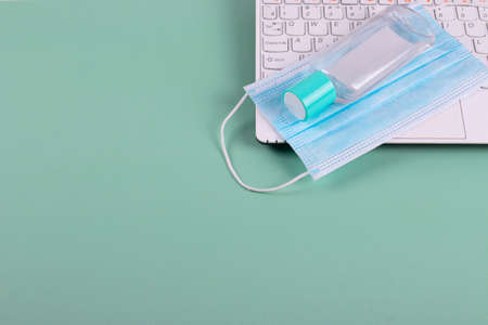 a white laptop and means of individual self protection from flu
