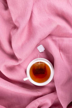 tea cup on the natural linen surfaceの写真素材