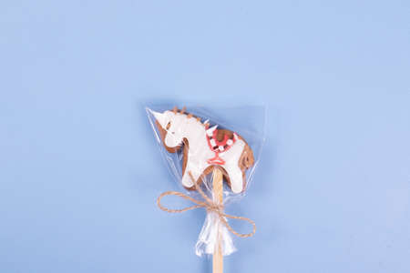 sweet yummy festive colorful lollipops on light blue background. copy space for text. minimalism styleの写真素材