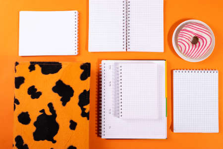 stationary with doughnut on orange background