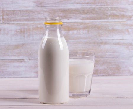 milk bottle and a glassの写真素材