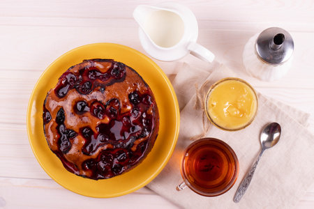 delicious freshly baked berry pie on a rustic backgroundの写真素材