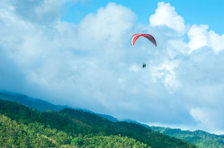 People fly on hang glidersの写真素材