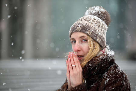 Young woman freezing in wintertimeの写真素材