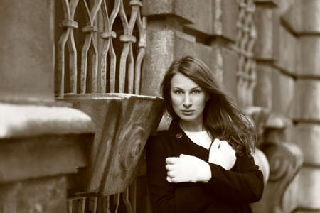 Beautiful brunette girl in front of a baroque palace in Vienna, Austriaの写真素材
