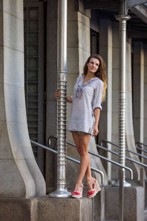 Young woman wearing blouse and shortsの写真素材