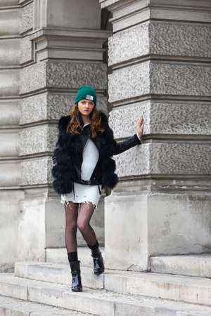 Elegant woman with cap and winter jacketの写真素材