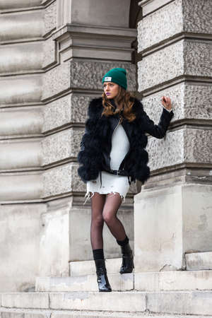 Elegant woman with cap and winter jacketの写真素材