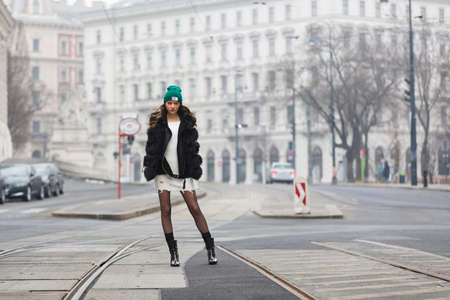 Elegant woman with cap and winter jacketの写真素材