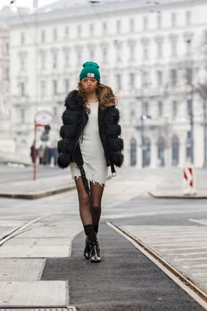 Elegant woman with cap and winter jacketの写真素材