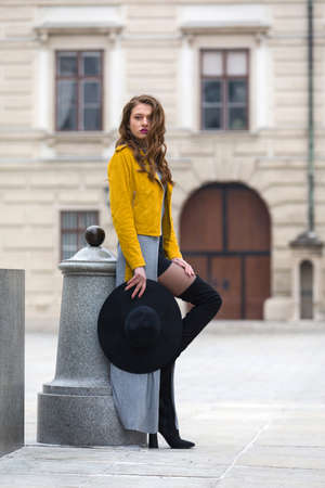 Woman with over the knee boots and leather jacketの写真素材