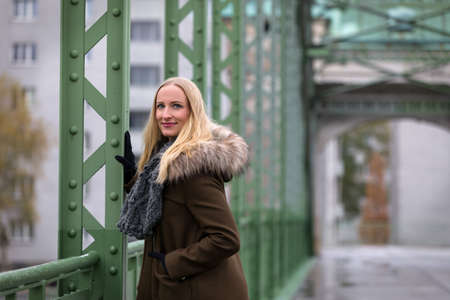 Beautiful blonde woman wearing winter jacketの写真素材