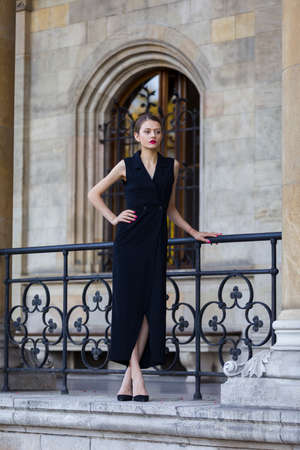 Young woman wearing long black dressの写真素材