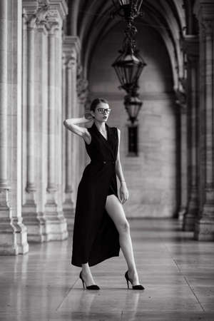 Young woman wearing long black dressの写真素材