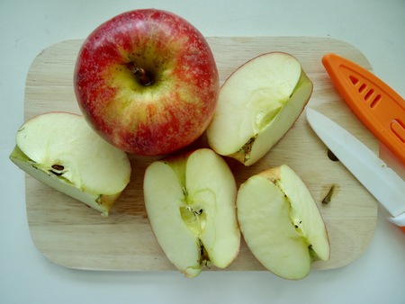 Red apple was cut into pieceの写真素材