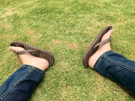 My foot, foot sandal and pantsの写真素材