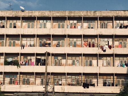 Part of outside apartment buildings structure, wall and windows as texture or for backgroundの写真素材