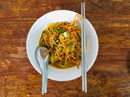 Curry noodle soup with chicken (Khao Soi), North of Thailand popular local foodの写真素材