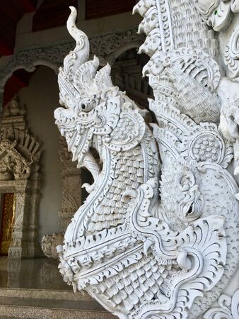 Beautiful finely of Ancient King of Naga statue, traditional Thai style decorative in templeの写真素材